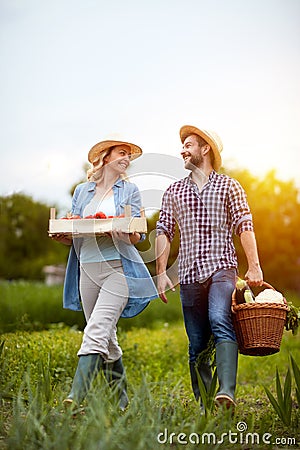 Satisfied couple returning from business in garden Stock Photo