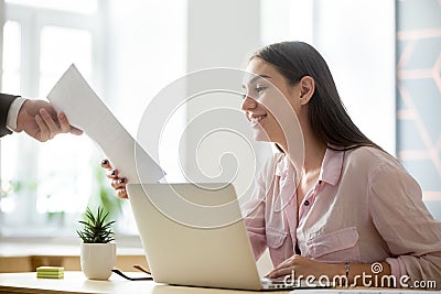 Satisfied female intern getting positive feedback from employer Stock Photo