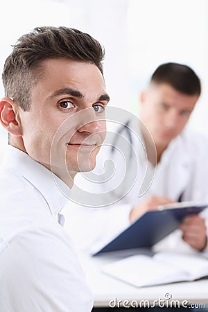 Satisfied happy handsome smiling male patient Stock Photo