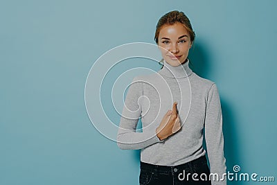 Satisfied pleased woman points at herself being chosen receives great news Stock Photo