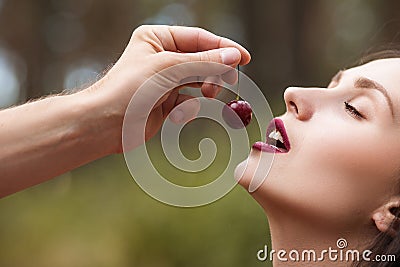 Satisfied pretty temptation woman cherry concept. Stock Photo