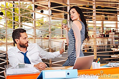 Satisfied woman seducing her boss Stock Photo