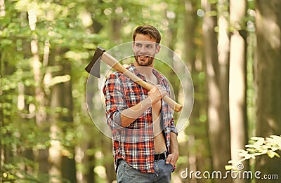 Satisfied for the work done. cutter going to cut tree. lumberjack holding ax in hands. wanderlust, hiking and travel Stock Photo