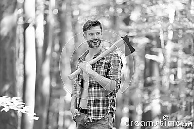 Satisfied for the work done. cutter going to cut tree. lumberjack holding ax in hands. wanderlust, hiking and travel Stock Photo