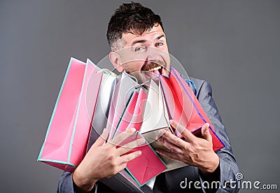 Satisfying shopping tour. Man bearded businessman customer carry many shopping bags. Shopping with discount enjoy Stock Photo