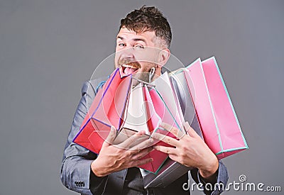 Satisfying shopping tour. Man bearded businessman customer carry many shopping bags. Enjoy shopping profitable deals Stock Photo