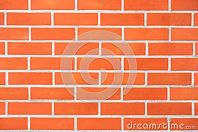 Saturated bright modern orange brick wall background Stock Photo