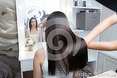 Saturated healthy shiny hair after keratin recovery. The concept of recovery structure. Stock Photo