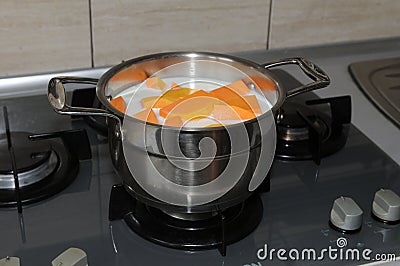 Saucepan with pumpkin in a milk Stock Photo