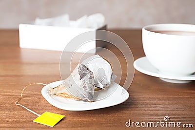 Saucer with pyramid teabags Stock Photo