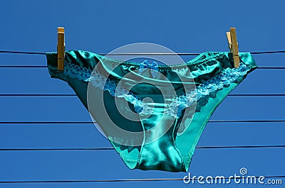 Saucy silk knickers on washing line Stock Photo