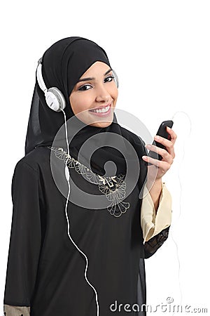 Saudi arab woman listening to the music from a smart phone Stock Photo