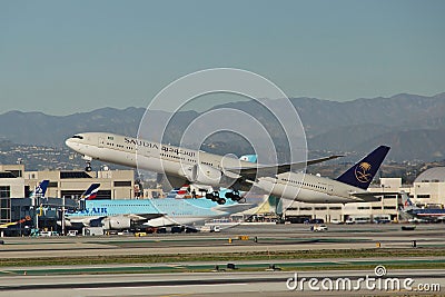 Saudi Arabian Airlines Boeing B-777-368(ER)HZ-AK21 departing Los Angeles . Editorial Stock Photo