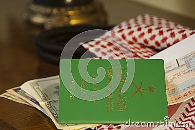 Saudi Travller Document Passport Flight Ticket Saudi Riyals Money and American Dollars Still Life with Shumagh Stock Photo