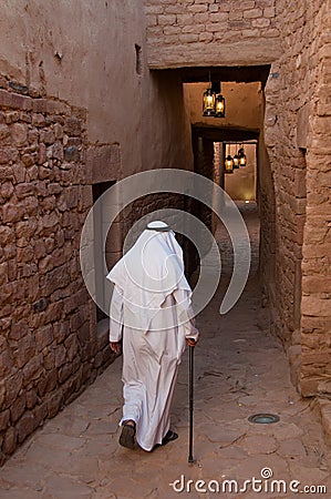 Saudian walking inside the walls of Al-Ula Old City, Saudi Arabi Editorial Stock Photo