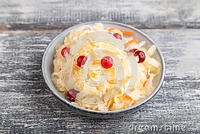 Sauerkraut, marinated cabbage on a gray wooden background. Side view, close up Stock Photo