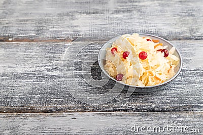 Sauerkraut, marinated cabbage on a gray wooden background. Side view, copy space Stock Photo