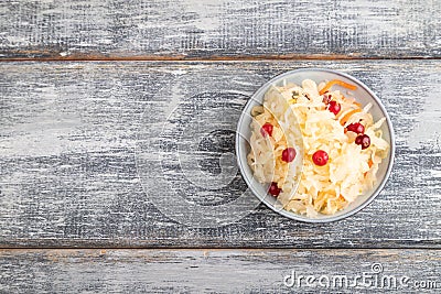 Sauerkraut, marinated cabbage on a gray wooden background. Top view, copy space Stock Photo