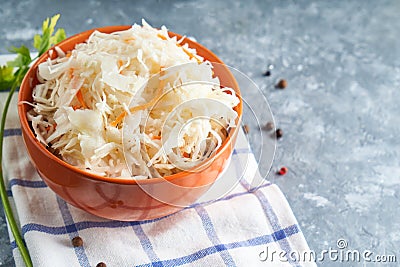 Sauerkraut with spices in an orange bowl. Natural Probiotics, Healthy Food Stock Photo