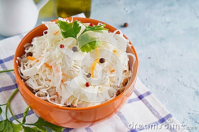 Sauerkraut with spices in an orange bowl. Natural Probiotics, Healthy Food Stock Photo