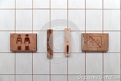 Sauna objects hanging on wall Stock Photo