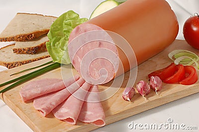 Sausage on the bread-board Stock Photo
