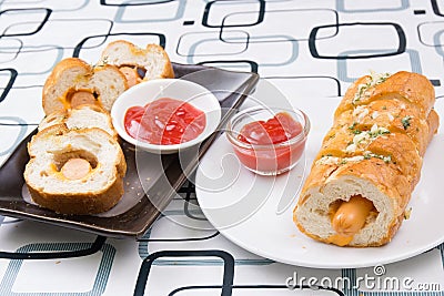 Sausage bread with ketchop Stock Photo