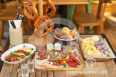 Sausage with snacks with vodka on the table Stock Photo