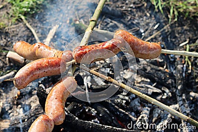 Sausage on fire Stock Photo