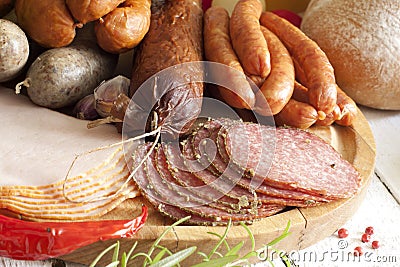 Sausage and meat assortment on cutting board Stock Photo
