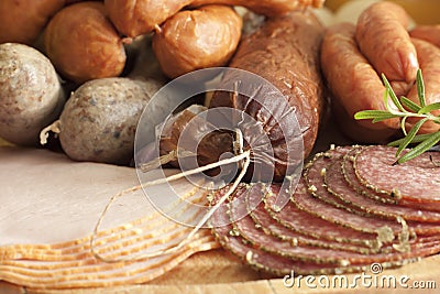 Sausage and meat assortment on cutting board Stock Photo