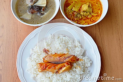 Sausage on rice with Bamboo shoot curry and soup Stock Photo