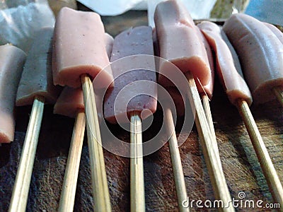 sausage skewers ready to be baked Stock Photo