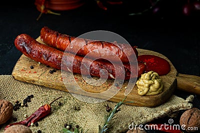 Sausages with cheese fried with spices and herbs Stock Photo