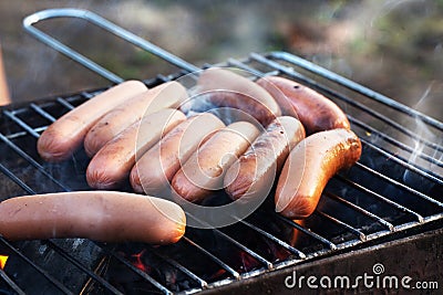 Sausages on the grill fire grate barbecue Stock Photo