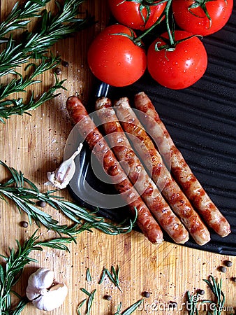 Sausages grilled on a board Stock Photo