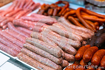 Sausages made of pork and chicken minced meat ready for grilling in meat department of store Stock Photo
