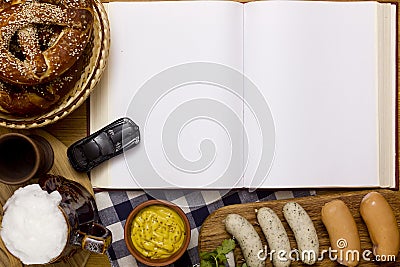 Sausages, pretzels, beer and a book Stock Photo