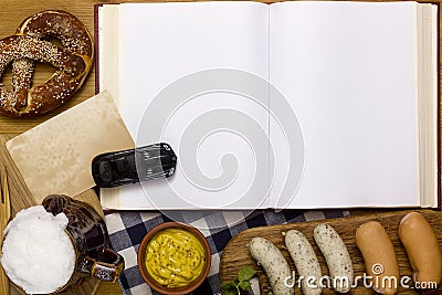 Sausages, pretzels, beer and a book Stock Photo