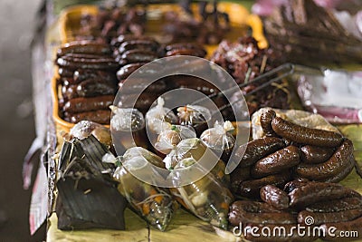 Sausages and typical Laotian food at the Muang Khua market Stock Photo