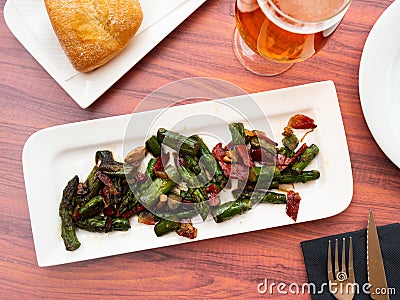 Sauteed asparagus with ham and foie chips closeup Stock Photo