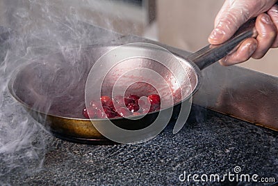 cherry sauce for poultry in a pan Stock Photo