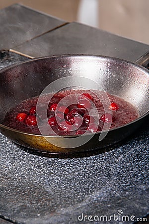 cherry sauce for poultry in a pan Stock Photo