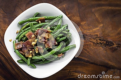 Sauteed garlic butter green beans with bacon Stock Photo