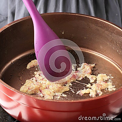 Sauteed garlic in a frying pan Stock Photo