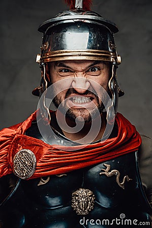 Savage and anrgy roman warrior with armour Stock Photo