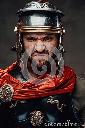 Savage and anrgy roman warrior with armour Stock Photo