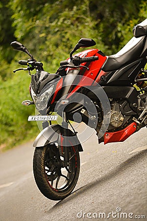 Savanadurga,India - DECEMBER 31, 2018: Bajaj Pulsar 200 NS parked at the center of the road Editorial Stock Photo