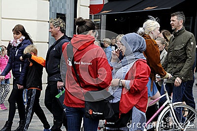SAVE THE CHILDREN WORKER IN RED JACKET Editorial Stock Photo