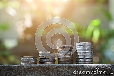 Save money concept with coin stack growing Stock Photo